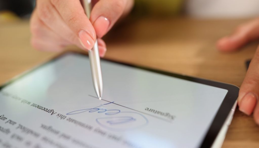 The person inserts the signature in a Word document.