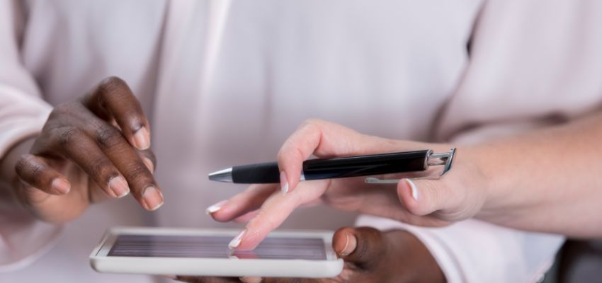 The woman teaches the man on how to avoid eSignature fraud.