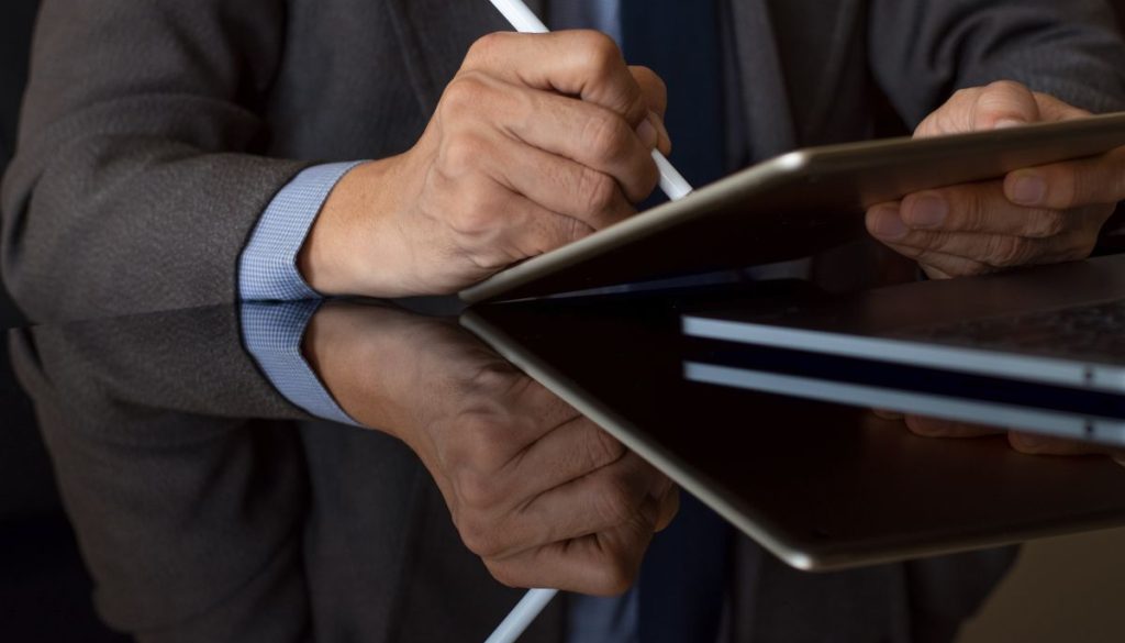 The professional is using DocuSign to sign contracts.