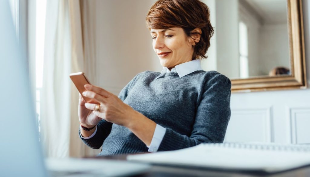 French woman signing documents online.