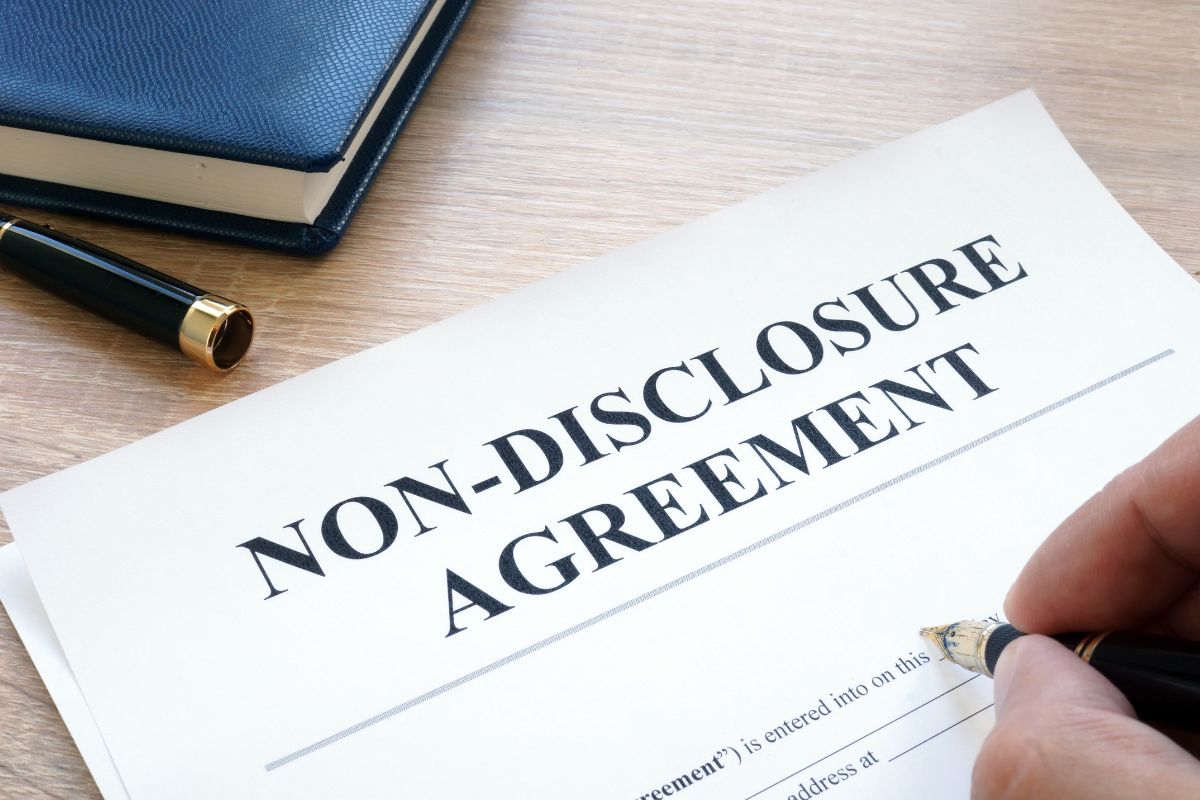 A professional holding signed non-disclosure agreements.