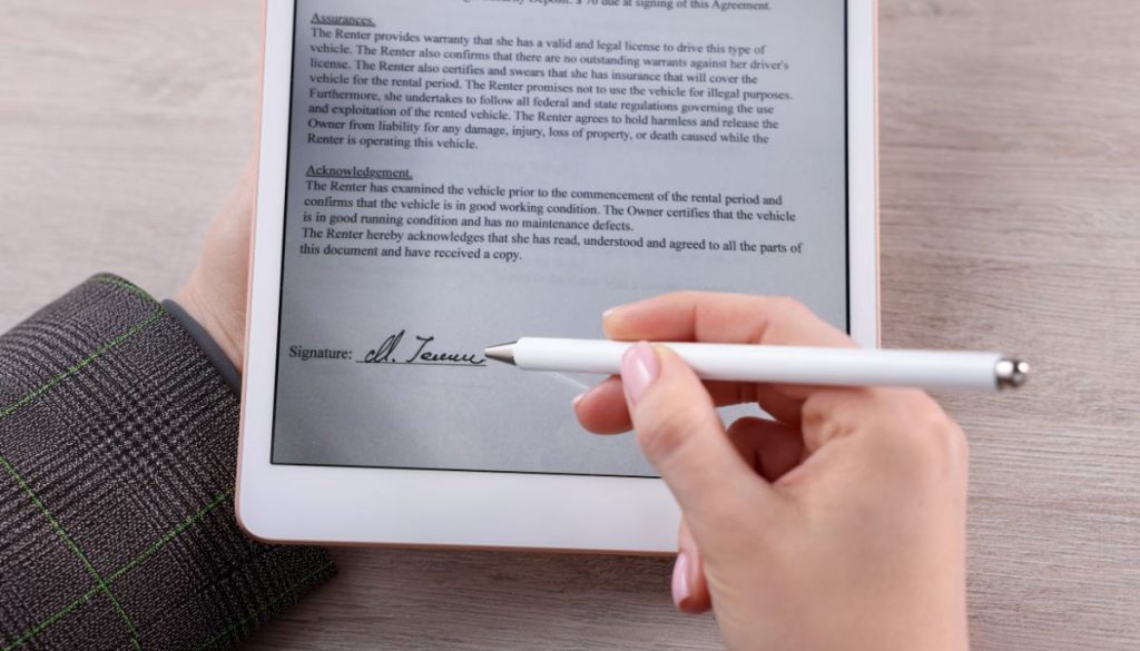 A person signs a digital file using an electronic signature.