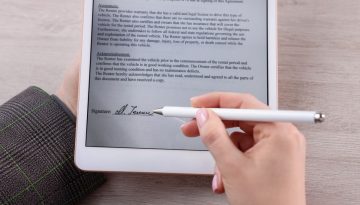 A person signs a digital file using an electronic signature.