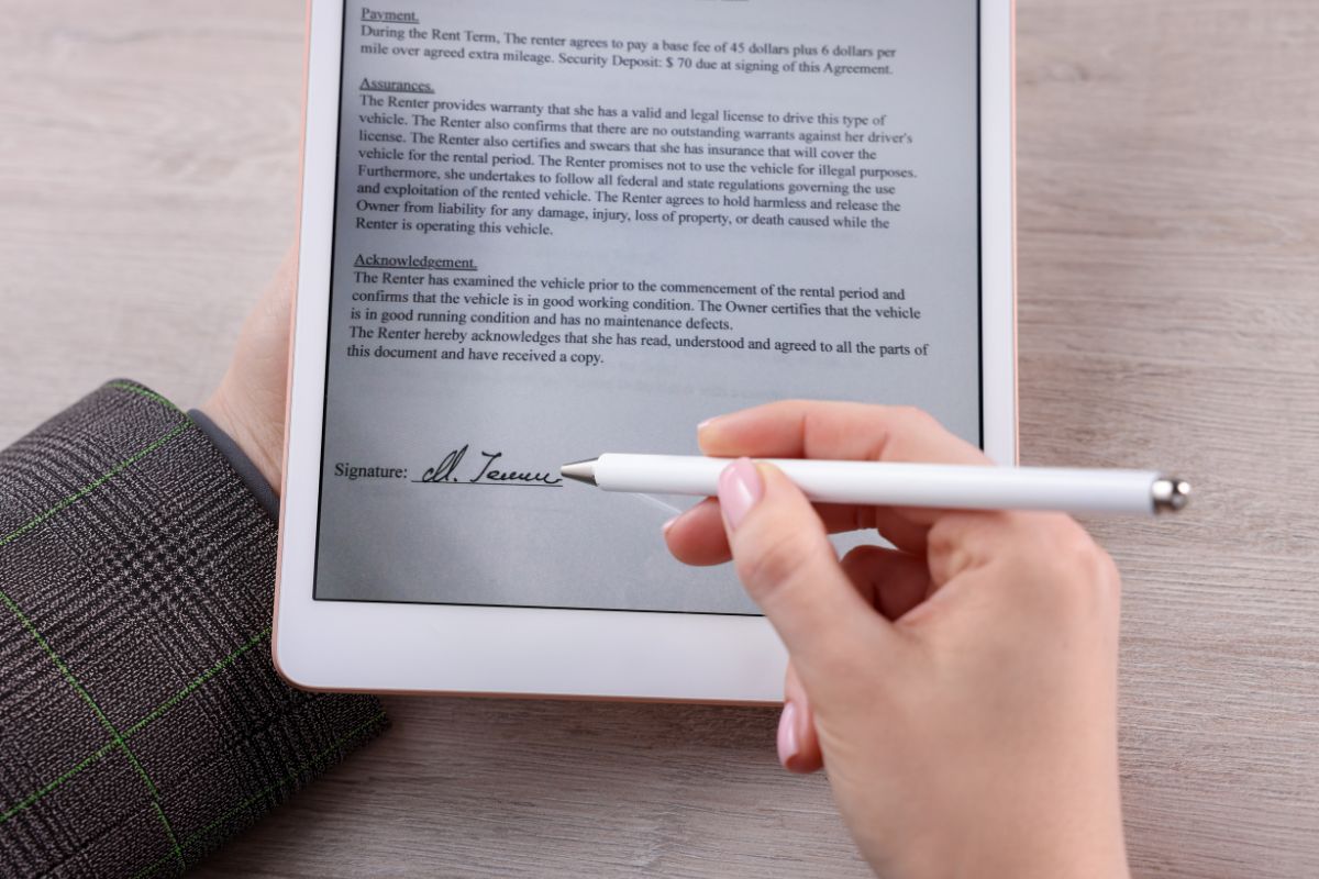 A person signs a digital file using an electronic signature.