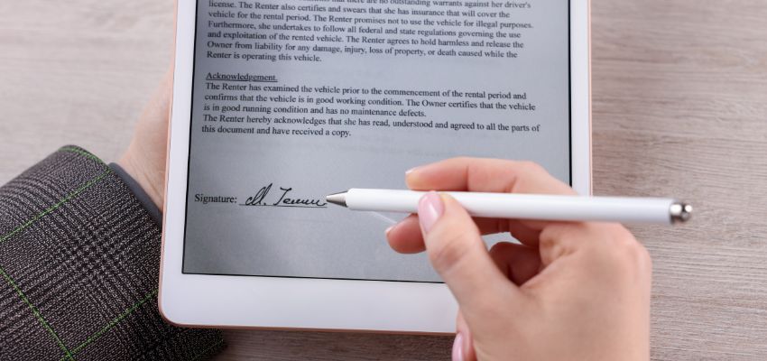 The woman creates an electronic signature to sign documents digitally.