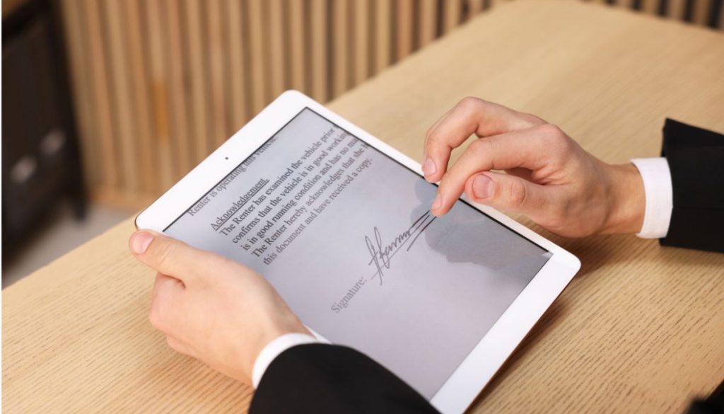 A man creates an electronic signature to sign documents digitally.