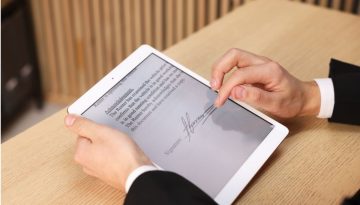 A man creates an electronic signature to sign documents digitally.