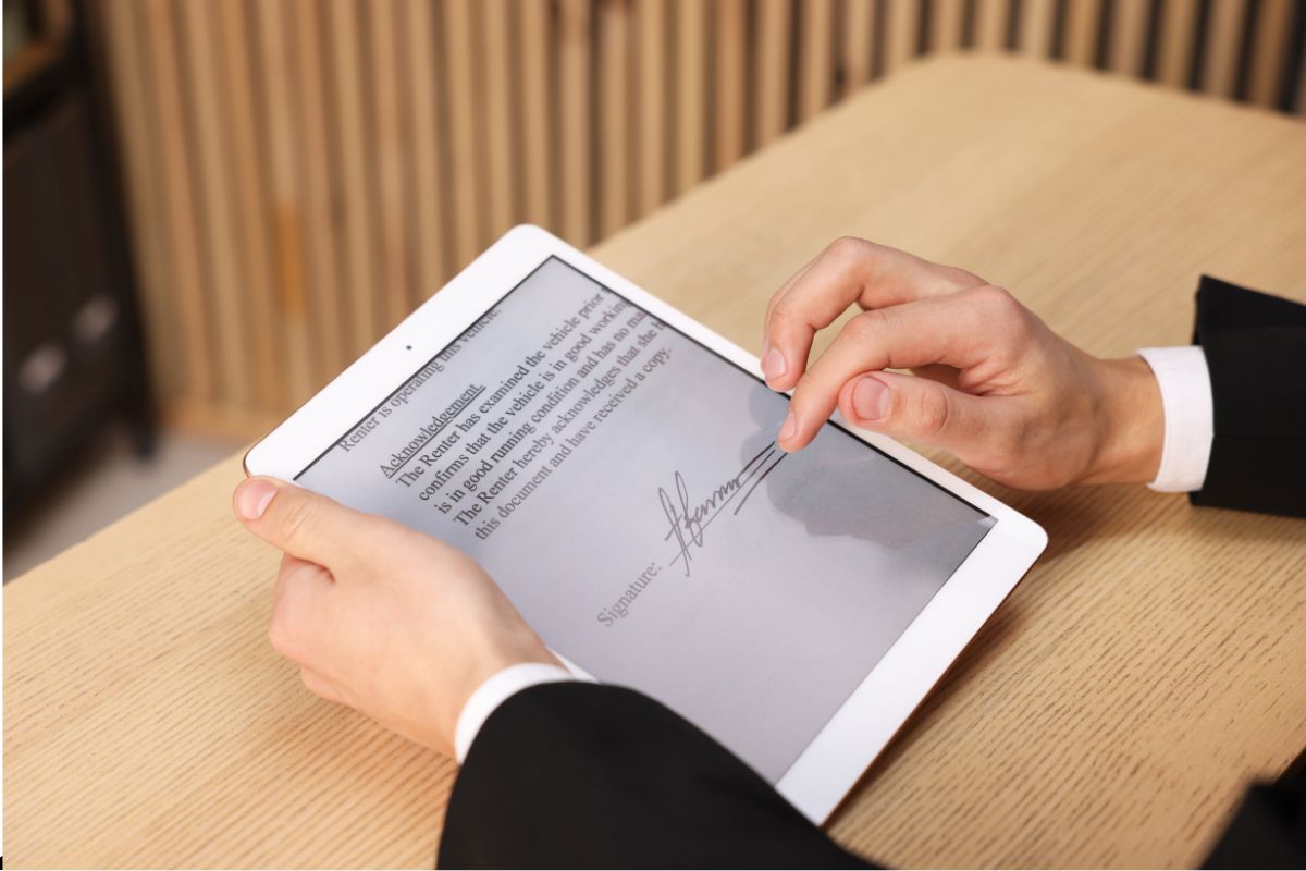 A man creates an electronic signature to sign documents digitally.