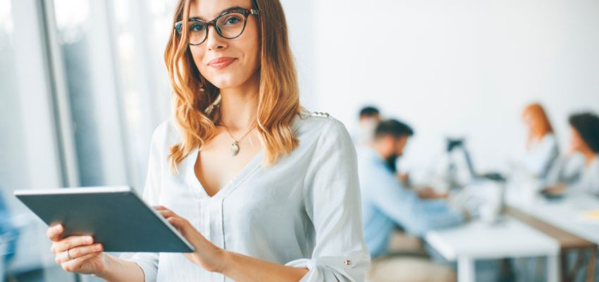 The woman is creating a digital contract.