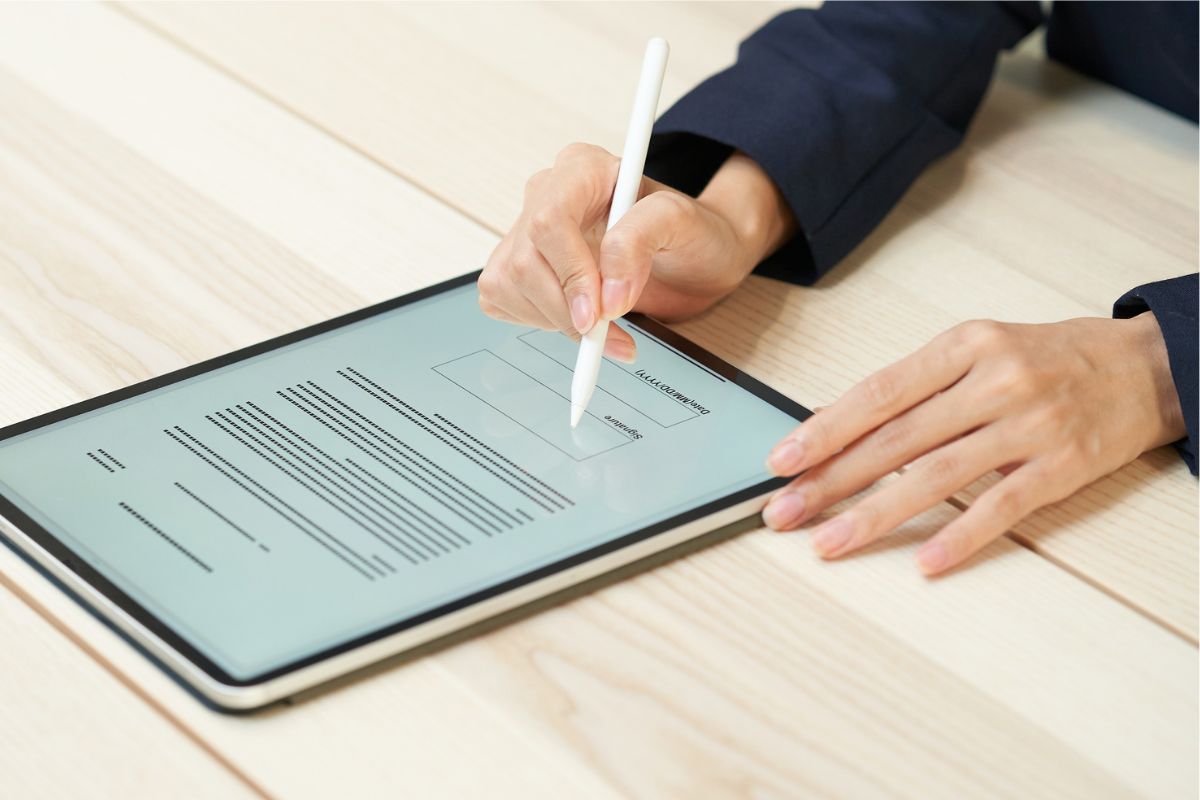The employee uses DocuSign to sign a digital contract.