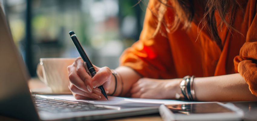 The woman is making a paper contract that could be fake, misplaced, or stolen.