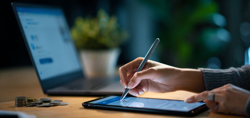 Businesswoman signs a digital contract using a digital signing tool service.